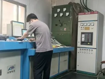Technician operating electrical testing equipment for dry-type transformers at Yingben factory